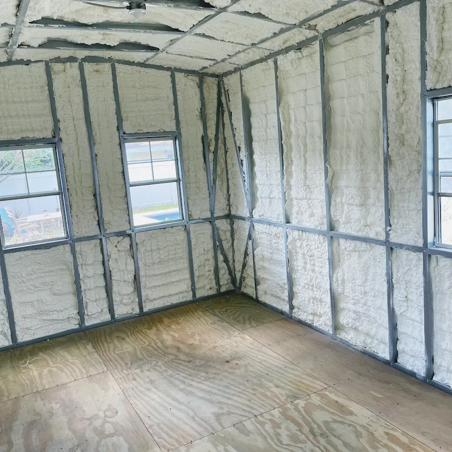 Closed-cell spray foam insulation applied to wall cavities in a residential project in Tuskegee